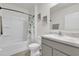 Bathroom featuring a shower with a tub, a marble vanity, and classic fixtures at 149 Hickory Course Cir, Ocala, FL 34472