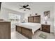 Bright bedroom featuring a wooden bed frame, a ceiling fan, and neutral paint for a relaxing atmosphere at 149 Hickory Course Cir, Ocala, FL 34472