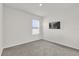 A light and bright bedroom with neutral paint and carpet at 149 Hickory Course Cir, Ocala, FL 34472