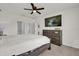 Inviting bedroom featuring a ceiling fan, a decorative dresser, and a bright, natural interior at 149 Hickory Course Cir, Ocala, FL 34472