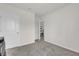 A simple bedroom with neutral paint and light carpet at 149 Hickory Course Cir, Ocala, FL 34472