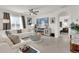 Bright living room features neutral walls, recessed lighting, tile floors and an electric fireplace at 149 Hickory Course Cir, Ocala, FL 34472