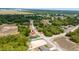 Beautiful aerial view of new home; large lot surrounded by a lush green landscape at 15296 Sw 56Th Terrace Rd, Ocala, FL 34473