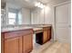 Primary bathroom with double vanity, granite counters, and well-lit mirror at 16137 Azure Key St, Winter Garden, FL 34787