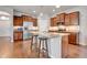 Spacious kitchen with granite countertops, stainless steel appliances, and a large center island with breakfast bar seating at 16137 Azure Key St, Winter Garden, FL 34787