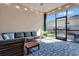 Bright sunroom with comfortable seating and view of the backyard at 16137 Azure Key St, Winter Garden, FL 34787