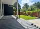 Relaxing backyard with sleek patio deck overlooking the well-manicured lawn at 1634 Hull Cir, Orlando, FL 32806