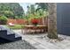 Backyard dining area on a paver patio with a modern, well-landscaped backyard at 1634 Hull Cir, Orlando, FL 32806