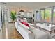Bright open-concept living room with a view into the kitchen, providing a stylish and spacious living at 1634 Hull Cir, Orlando, FL 32806