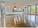 Open concept living space with modern fixtures and large windows bringing ample natural light at 1634 Hull Cir, Orlando, FL 32806