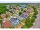 Aerial view showcasing homes in a residential neighborhood near a beautiful lake at 1730 Ribbon Falls Pkwy, Orlando, FL 32824