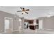 Kitchen features modern appliances, dark wood cabinets, tile floor, and an island at 1730 Ribbon Falls Pkwy, Orlando, FL 32824