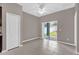 Living room featuring tile floor, a ceiling fan, and sliding glass doors to backyard at 1730 Ribbon Falls Pkwy, Orlando, FL 32824