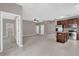 Open living space with tile floors, neutral walls, and an updated kitchen featuring stainless steel appliances and a center island at 1730 Ribbon Falls Pkwy, Orlando, FL 32824