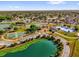 An aerial shot of community park with sports courts and recreational facilities by a scenic lake at 1851 Wimbledon St, Kissimmee, FL 34743