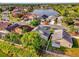 A stunning aerial view of a neighborhood with waterfront properties and lush greenery at 1851 Wimbledon St, Kissimmee, FL 34743