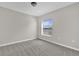 Bedroom featuring plush carpet, a window view, and neutral paint at 1851 Wimbledon St, Kissimmee, FL 34743