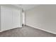 Bedroom featuring closet, carpet and neutral paint at 1851 Wimbledon St, Kissimmee, FL 34743