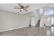 Bright living room with wood floors, staircase, and neutral walls for a modern, clean feel at 1851 Wimbledon St, Kissimmee, FL 34743