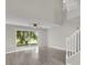 Bright and open living room with high ceilings, wood floors, and sliding glass doors to the backyard at 1851 Wimbledon St, Kissimmee, FL 34743