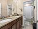 Well-appointed bathroom featuring dual sinks with granite countertops and ample cabinet space at 193 Captiva Dr, Davenport, FL 33896