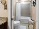 Bathroom with granite counters, white cabinets, and a bathtub with shower at 193 Captiva Dr, Davenport, FL 33896