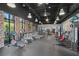 Modern gym featuring high ceilings, a variety of fitness equipment, and exposed brick accents at 193 Captiva Dr, Davenport, FL 33896