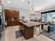 Open-concept kitchen and dining area, showcasing a large island and access to the living room at 193 Captiva Dr, Davenport, FL 33896