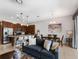 Open-concept living area with tile flooring, modern lighting, and a kitchen island with seating at 193 Captiva Dr, Davenport, FL 33896
