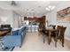 Open-concept living area featuring tile floors, modern kitchen, dining area, and comfortable seating at 193 Captiva Dr, Davenport, FL 33896