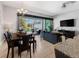 Bright and open living space featuring tile flooring, dining area, and a view of the pool at 193 Captiva Dr, Davenport, FL 33896