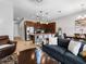Open-concept living area with tile flooring, modern lighting, and a kitchen island with seating at 193 Captiva Dr, Davenport, FL 33896