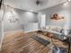 Cozy living room featuring plank floors, soft lighting, and minimalist decor at 193 Captiva Dr, Davenport, FL 33896