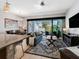Open-concept living area with tile flooring, modern kitchen, dining area, and comfortable seating at 193 Captiva Dr, Davenport, FL 33896