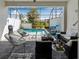 A screened patio with brick pavers and a view of the private pool and backyard at 193 Captiva Dr, Davenport, FL 33896
