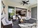 Cozy patio with outdoor seating and views into the open living space at 193 Captiva Dr, Davenport, FL 33896