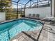 A private pool is surrounded by brick pavers and has lots of space for lounging at 193 Captiva Dr, Davenport, FL 33896