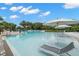 The community pool has lounge chairs and umbrellas for residents to enjoy at 193 Captiva Dr, Davenport, FL 33896