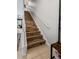 Whimsical staircase featuring charming mouse decals and a view to the living room at 193 Captiva Dr, Davenport, FL 33896