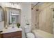 Bright bathroom featuring a shower-tub combo, vanity with sink, and neutral color palette at 207 Sterling Springs Ln, Altamonte Springs, FL 32714