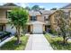 Charming townhome featuring a one car garage, wooden shutters and a cozy front porch at 207 Sterling Springs Ln, Altamonte Springs, FL 32714