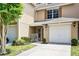 Charming townhome featuring a one car garage, wooden shutters and a cozy front porch at 207 Sterling Springs Ln, Altamonte Springs, FL 32714