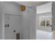Laundry room with hookups and shelving, adjacent to a bedroom at 207 Sterling Springs Ln, Altamonte Springs, FL 32714