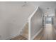 A carpeted staircase leads up from the entry hall, with hardwood flooring at 207 Sterling Springs Ln, Altamonte Springs, FL 32714