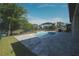 Backyard featuring a pool with brick pavers and black metal fencing surrounding the perimeter at 2168 Marsh Sedge Ln, Winter Park, FL 32792