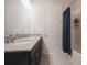 Bathroom featuring a single sink vanity with granite countertops and shower with curtain at 2168 Marsh Sedge Ln, Winter Park, FL 32792