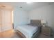A comfortable bedroom featuring a stylish bed frame, soft carpets, and bright windows for a restful night's sleep at 2168 Marsh Sedge Ln, Winter Park, FL 32792