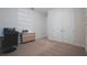 Spare bedroom with built in desk and storage, carpet flooring, and natural light at 2168 Marsh Sedge Ln, Winter Park, FL 32792