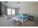 Cozy bedroom featuring bright windows, a comfortable bed, and stylish decor for relaxing nights at 2168 Marsh Sedge Ln, Winter Park, FL 32792