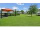 Well-maintained dog park with lush grass, fencing, and shade for pets to enjoy at 2168 Marsh Sedge Ln, Winter Park, FL 32792